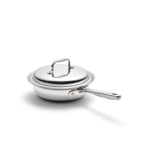 Angled view of 1.5 Quart Sauté with Cover showcasing stainless-steel body and long ergonomic handle on white background