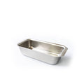 Angled view of stainless steel loaf pan with tab handles showcasing generous size and smooth interior on white background