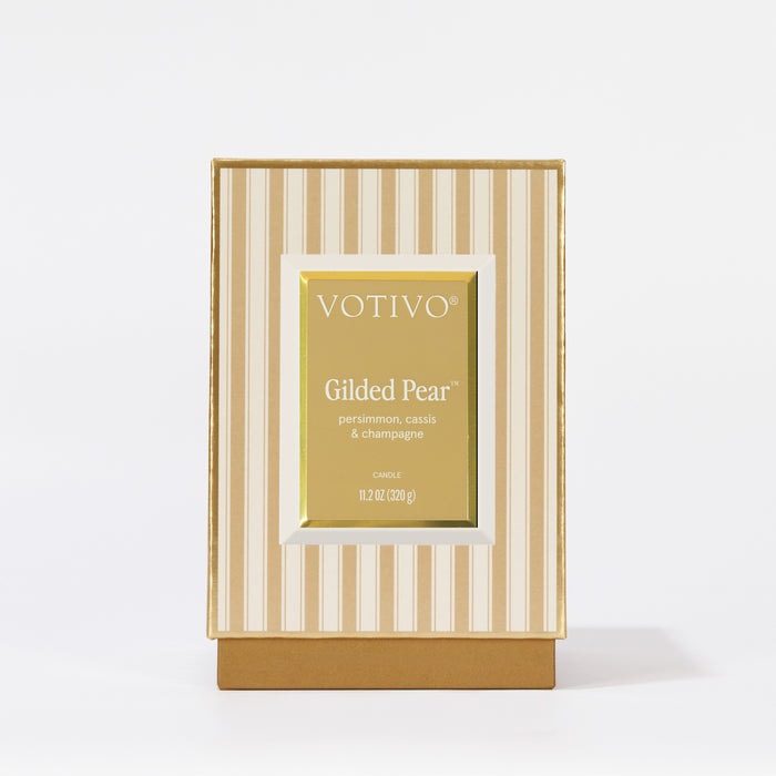 A gold and cream striped box, labeled Votivo Gilded Pear Holiday Candle—persimmon, cassis & champagne scent—11.2 oz (320 g), set against a white background.