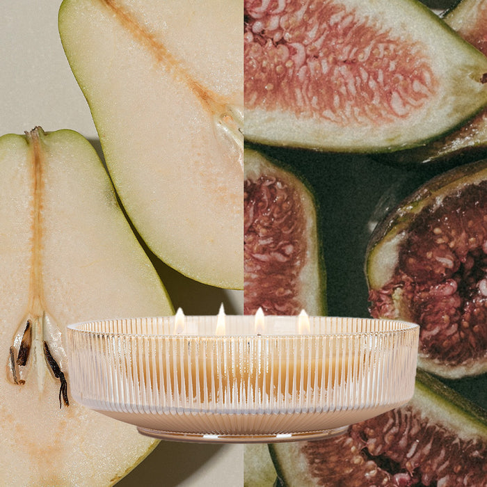 The Votivo Gilded Pear Holiday Multi-Wick Candle features a cozy gilded pear fragrance. Presented in a glass vessel, this soy blend candle is perfect for adding warmth and holiday charm to any space.