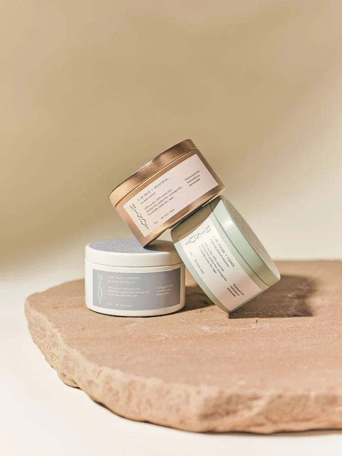 Calm + Content is one of three affirmation candles made of non-toxic soy wax in 5 oz. travel tins