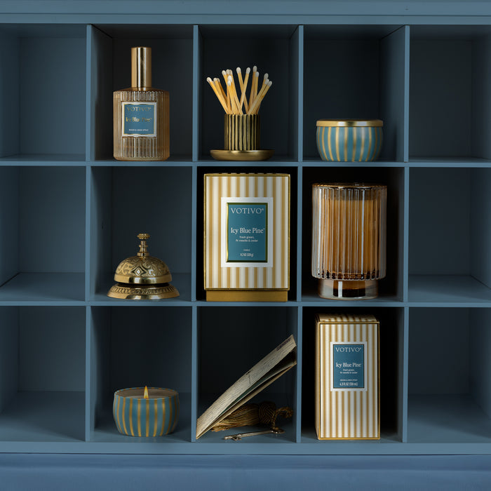 Votivo's Icy Blue Pine Full Collection of Candles & Room sprays in a decorative blue cubby