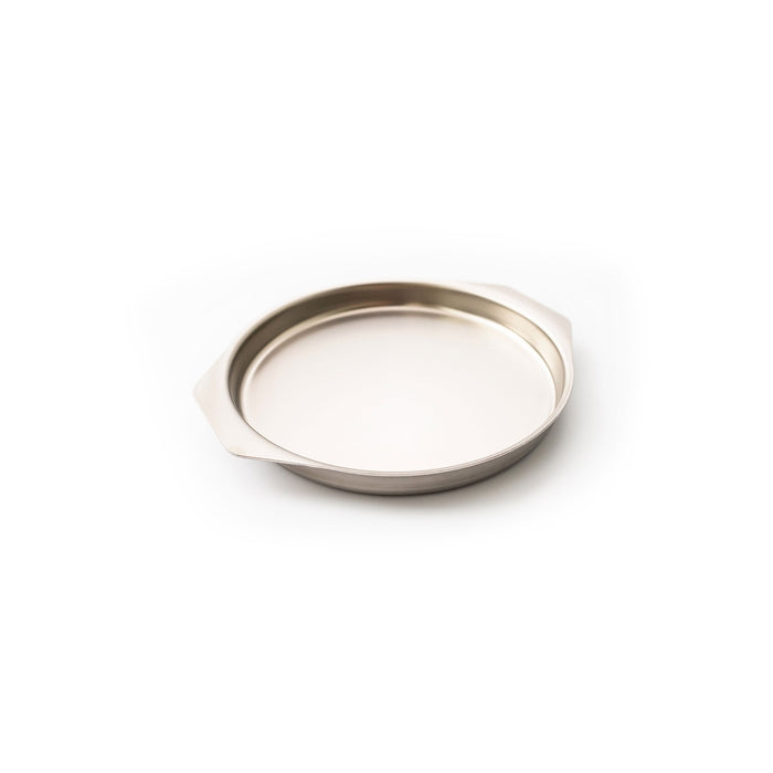 Shallow round stainless-steel baking pan with two flat tab handles on white background