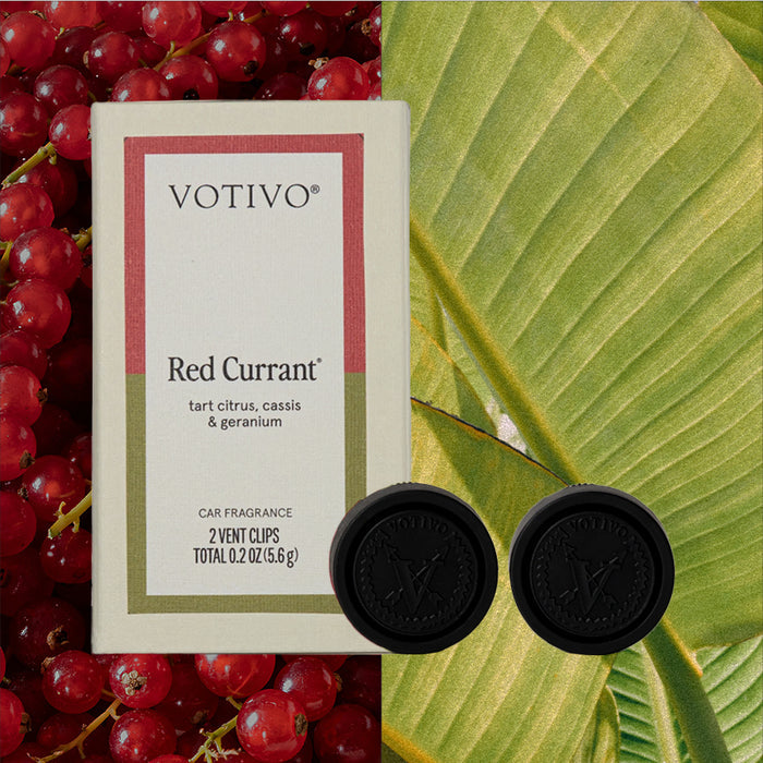A Votivo Red Currant Car Fragrance (2 Pack) box is displayed on a split background of red currants and a green leaf, with two black Votivo-branded vent clips positioned in front.