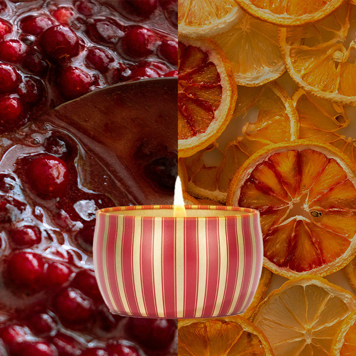 At the center, the Votivo Red Currant Holiday Tin Candle features festive scents like red currant. Crafted from soy blend wax in a striped red and gold tin, it’s flanked by cranberry sauce on one side and dried orange slices on the other.