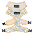 Lucy & Co. reversible dog harness with floral print on one side and yellow gingham on the other, made of neoprene.
