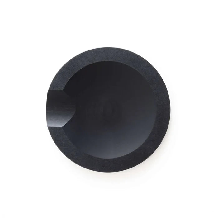 Top-down view of Slate Round tool rest showing round slate surface with notched edge for holding utensils on white background