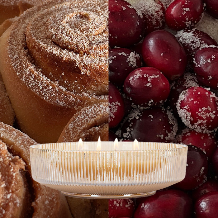 A split-image shows cinnamon rolls on the left, sugared cranberries on the right, and the Votivo Velvet Rouge Holiday Multi-Wick Candle in a ribbed glass container at bottom center, filling the scene with its cozy fragrance.